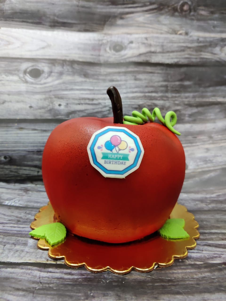 Apple-shaped birthday cake